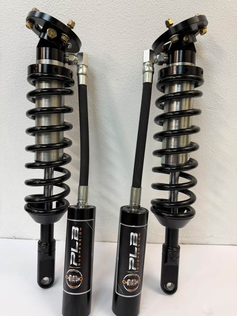 Example PLB vehicle coilover pair with springs and reservoirs